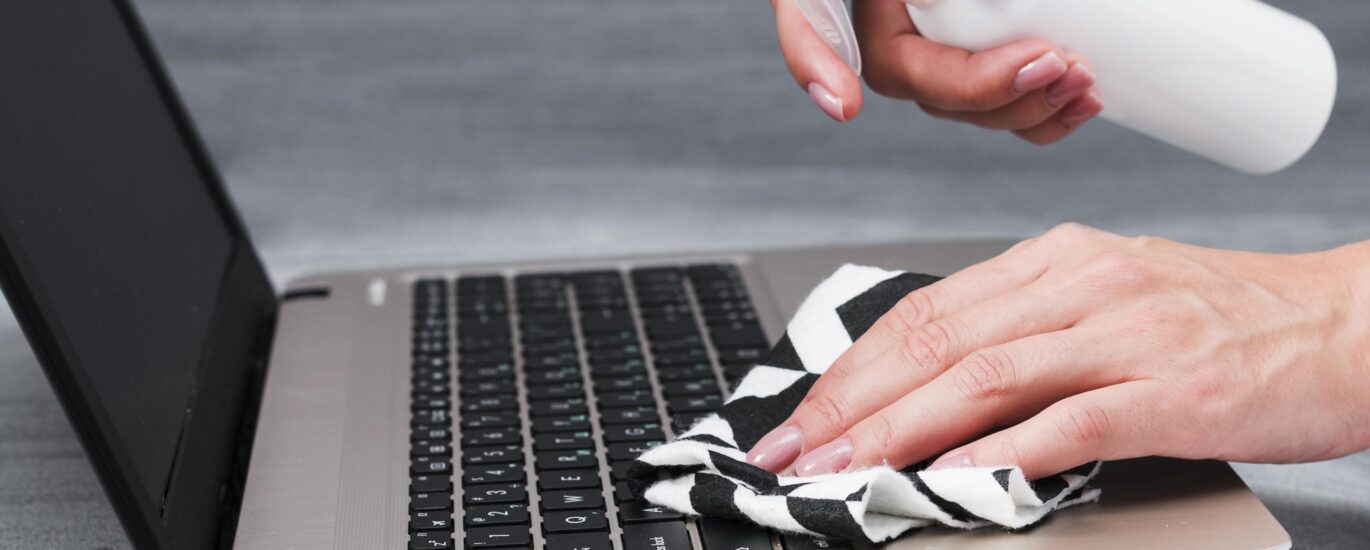 Close-up image showing MacBook Pro screen burn marks with visible dark patches and uneven brightness on the display.