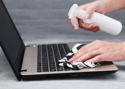 Close-up image showing MacBook Pro screen burn marks with visible dark patches and uneven brightness on the display.