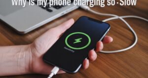 “Smartphone plugged in but charging slowly, showing slow battery increase and user checking cable for why is my phone charging so slow.”